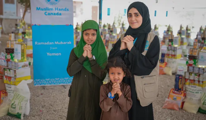 Muslim Hands Staff with Beneficiaries in Yemen 